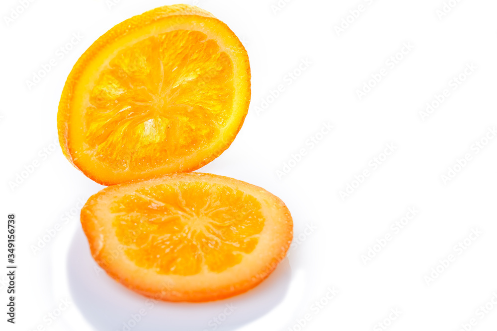 Slices Dried oranges or tangerines isolated on a white background. Vegetarianism and healthy eating Slices Dried oranges or tangerines isolated on a white background. Vegetarianism and healthy eating