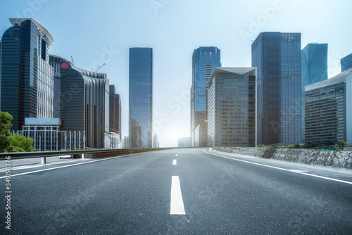 Asphalt floor and urban modern architecture