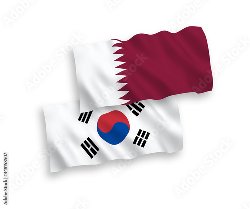 National vector fabric wave flags of South Korea and Qatar isolated on white background. 1 to 2 proportion.