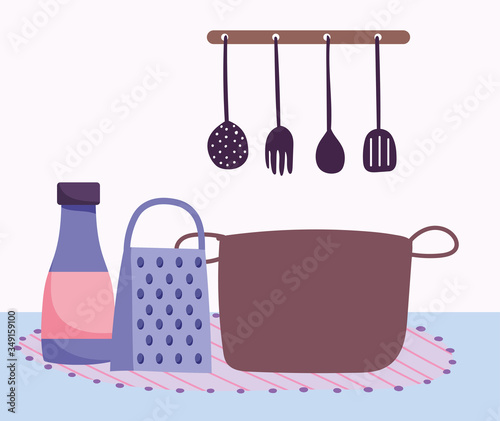 pot grater sauce bottle and kitchen utensils cooking