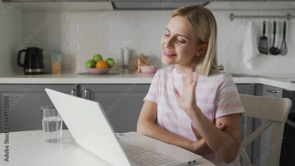 Happy woman talking at computer. Smiling person having online chat Happy woman talking at computer. Smiling person having online chat
