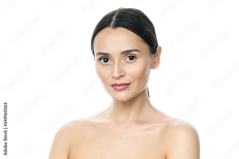 Beautiful smiling woman with clean skin, natural make-up, and white teeth on white background Beautiful smiling woman with clean skin, natural make-up, and white teeth on white background