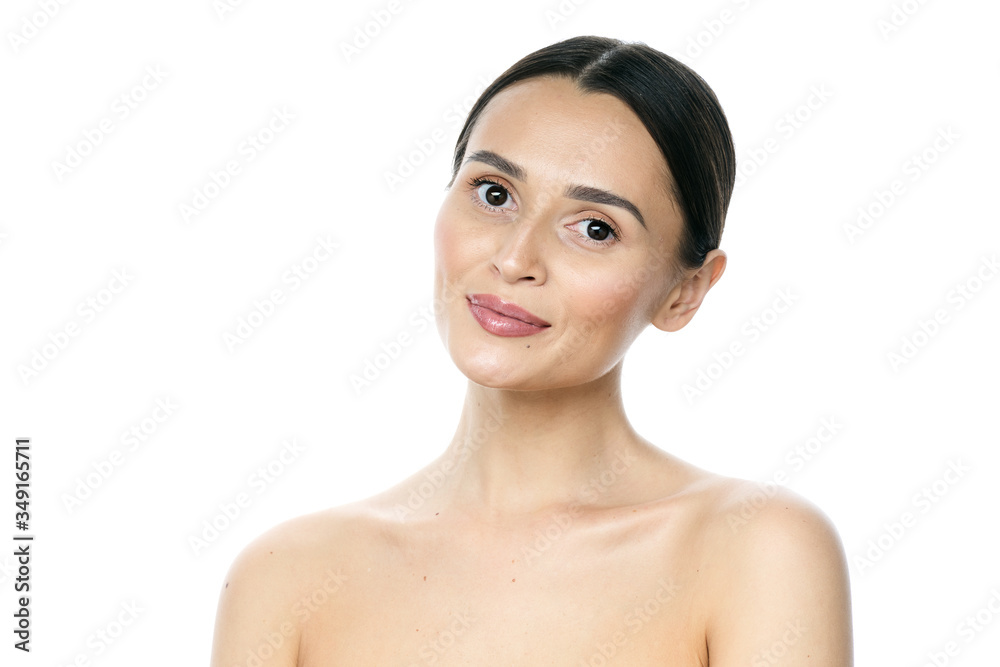 Beautiful smiling woman with clean skin, natural make-up, and white teeth on white background Beautiful smiling woman with clean skin, natural make-up, and white teeth on white background