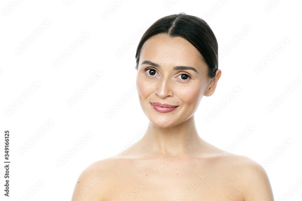 Beautiful smiling woman with clean skin, natural make-up, and white teeth on white background Beautiful smiling woman with clean skin, natural make-up, and white teeth on white background