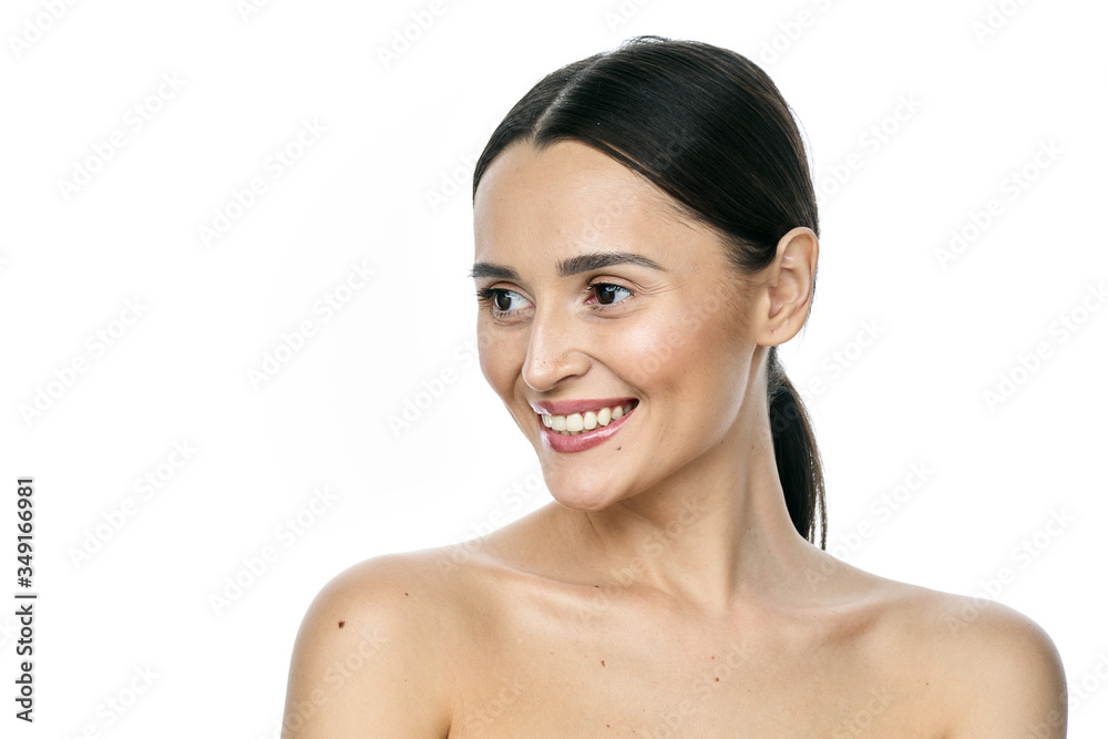 Beautiful smiling woman with clean skin, natural make-up, and white teeth on white background Beautiful smiling woman with clean skin, natural make-up, and white teeth on white background