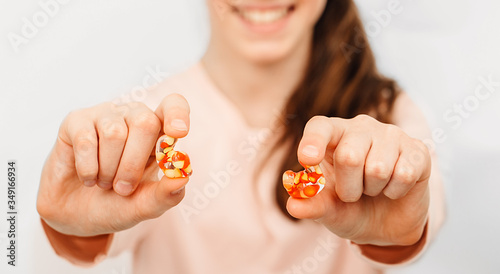 Φωτογραφία Girl holding earplugs in the foreground