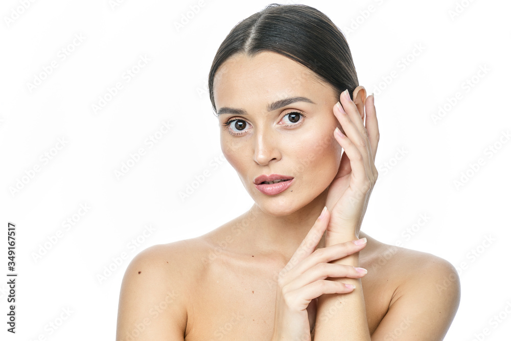 Beautiful smiling woman with clean skin, natural make-up, and white teeth on white background Beautiful smiling woman with clean skin, natural make-up, and white teeth on white background