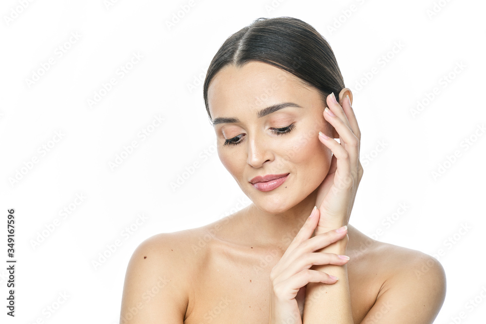 Beautiful smiling woman with clean skin, natural make-up, and white teeth on white background Beautiful smiling woman with clean skin, natural make-up, and white teeth on white background