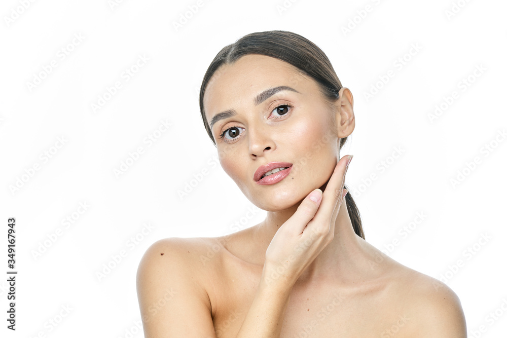 Beautiful smiling woman with clean skin, natural make-up, and white teeth on white background Beautiful smiling woman with clean skin, natural make-up, and white teeth on white background