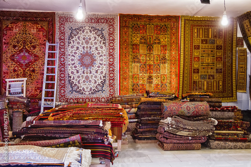 Traditional iranian carpets, rugs and scarfs shop in Isfahan bazaar. Esfahan bazaar is one of the oldest and biggest in Iran. photo