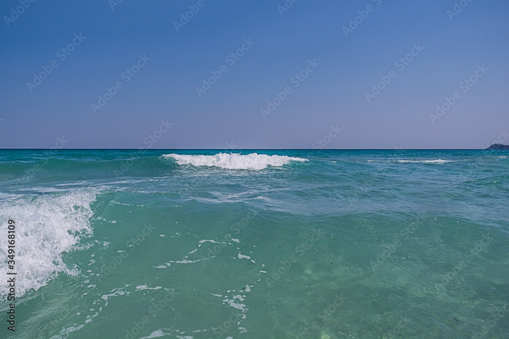 Clear sea water with clean blue sky