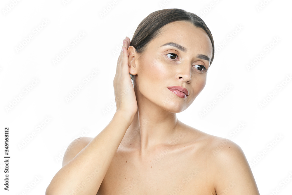 Beautiful smiling woman with clean skin, natural make-up, and white teeth on white background Beautiful smiling woman with clean skin, natural make-up, and white teeth on white background