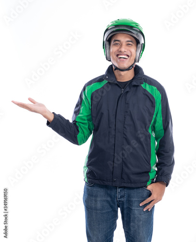 portrait of male motor taxi driver or rider with his uniform presenting to copy space isolated over white background