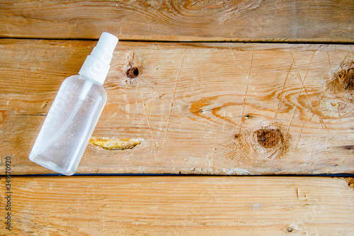 Alcohol hand sanitizer with old wooden background, preventation coronavirus photo