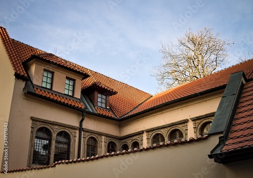 Old building with a series of windows and a tiled roof (Prague, Czech Republic, Europe)