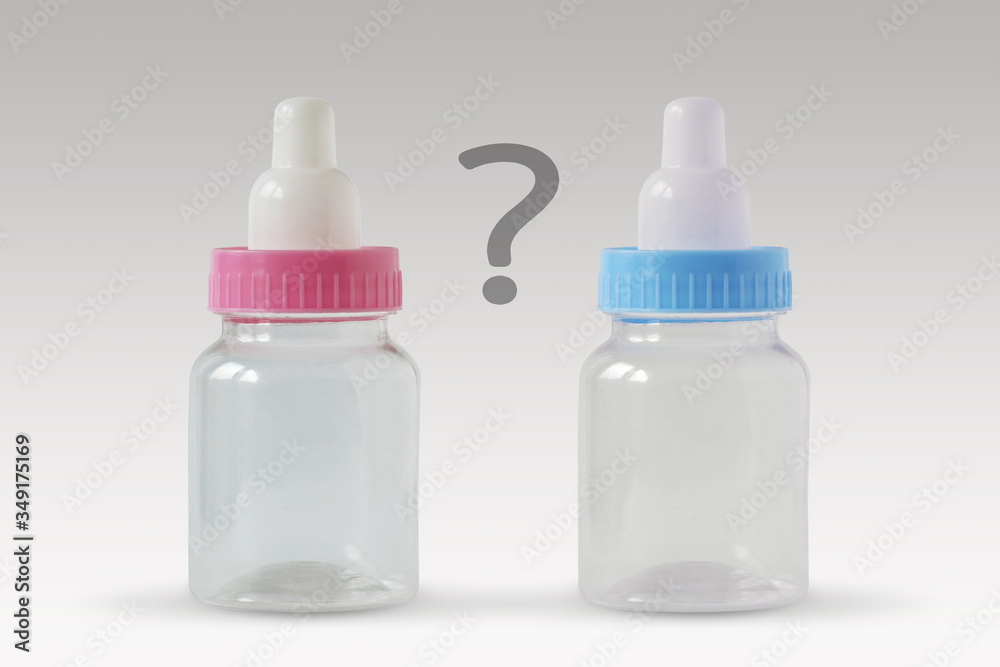 Pink and blue baby bottles with question mark - Male or female? Concept of future baby gender Pink and blue baby bottles with question mark - Male or female? Concept of future baby gender