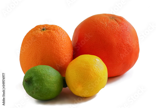 colored bright whole citrus fruits on a white background