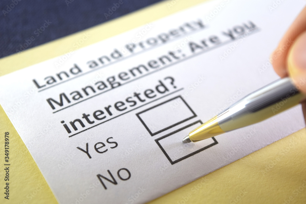One person is answering question about land and property management. One person is answering question about land and property management.