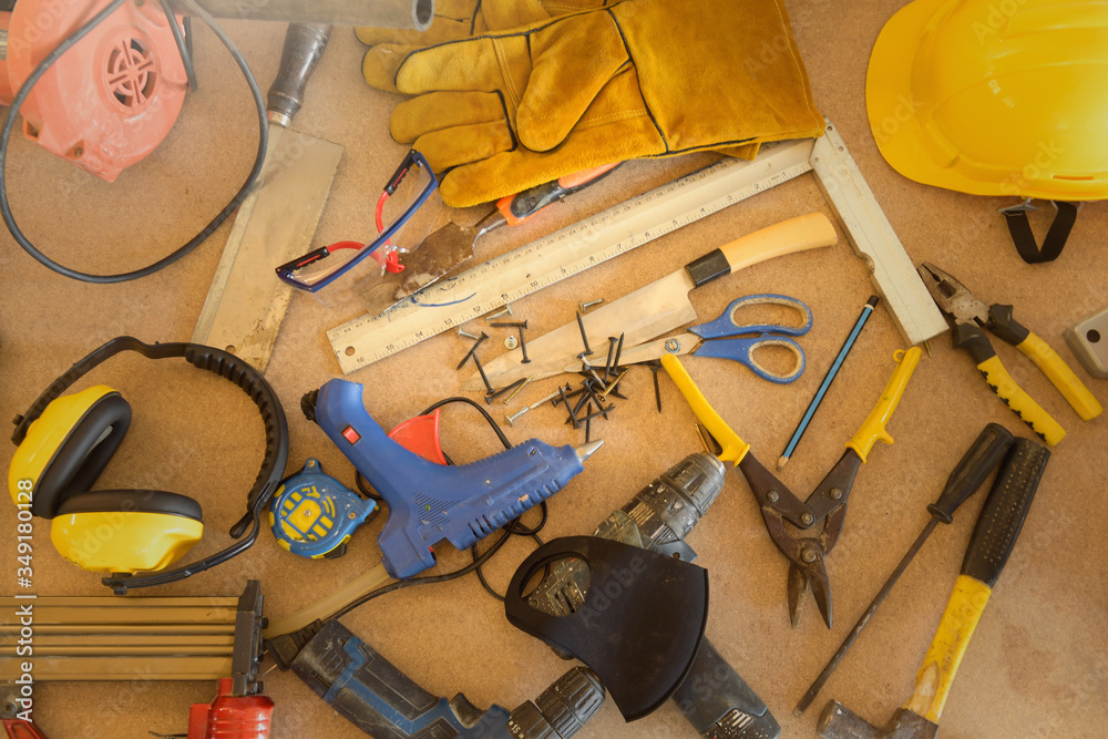 A desk of contractor engineers.collection of working tools on a workbench,Carpenter tools – A carpenters bench with various tools