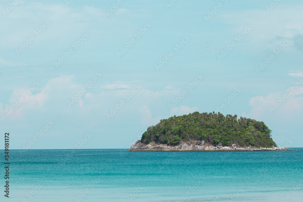 small island in the blue sea and clear sky