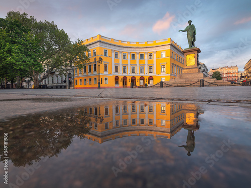 morning light on central square and monument of city founder of Odessa in Ukraine with reflections and copy space