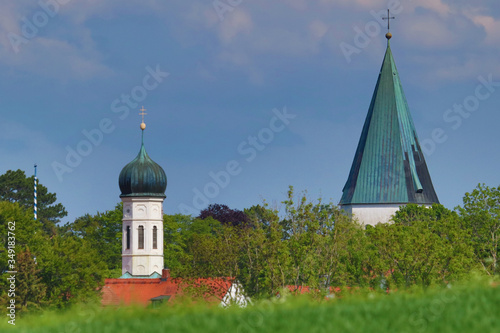 Pöcking, Landkreis Starnberg, Kirchtürme von St.Ulrich und St.Pius gesehen von einem Feld vor Pöcking photo