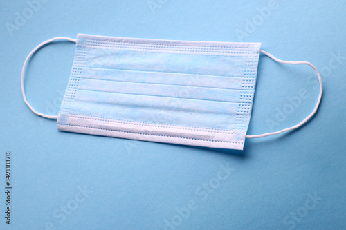 disposable blue face masks to stop viruses on a blue background