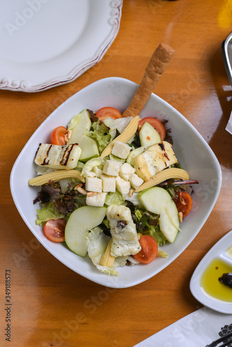 avocado, tomato, lettuce, green apple, mixed salad ready for presentation photo