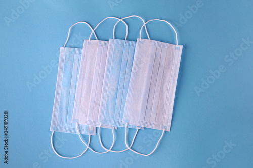 Medical mask, Medical protective masks on blue background. Disposable surgical face mask cover the mouth and nose. Healthcare and medical concept. Corona virus