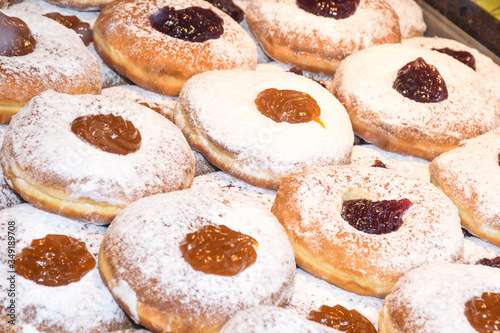 Photography Display of traditional doughnuts on sale at Christmas market stall in Austria