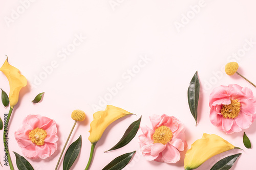 Flatlay of gift card on pink backdrop. Floral background. Spring summer conce...