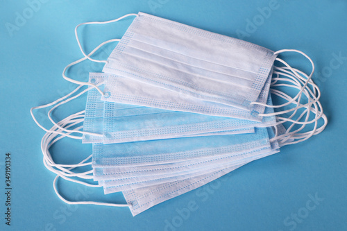 Medical mask, Medical protective masks on blue background. Disposable surgical face mask cover the mouth and nose. Healthcare and medical concept. Corona virus