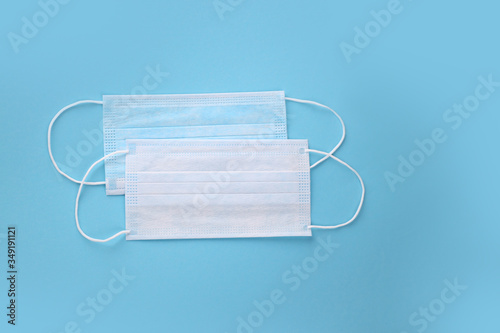 Medical mask, Medical protective masks on blue background. Disposable surgical face mask cover the mouth and nose. Healthcare and medical concept. Corona virus