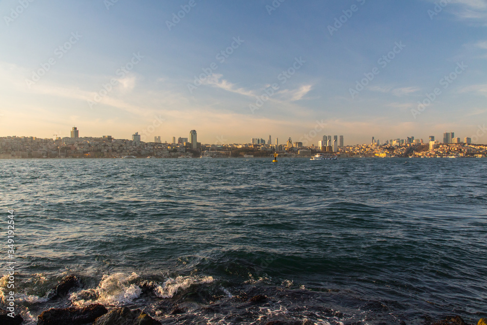 Fototapeta premium View of the Taksim district of Istanbul from the Bosphorus at sunset. Turkey