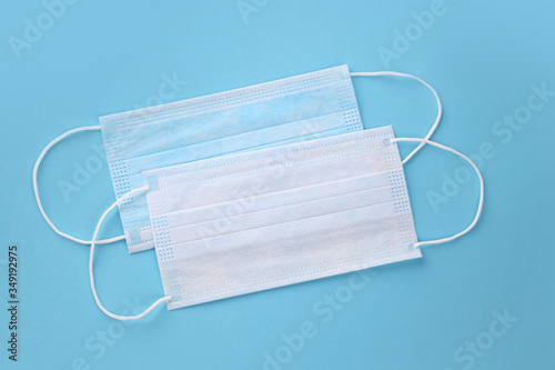Medical mask, Medical protective masks on blue background. Disposable surgical face mask cover the mouth and nose. Healthcare and medical concept. Virus