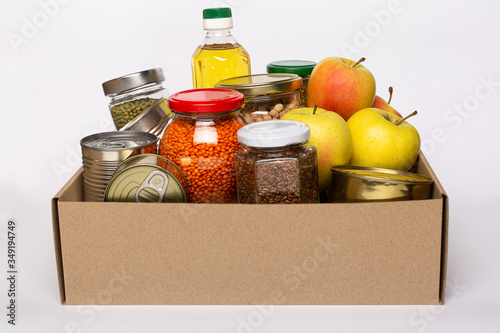 фотографія Donation box with various food on whiite background