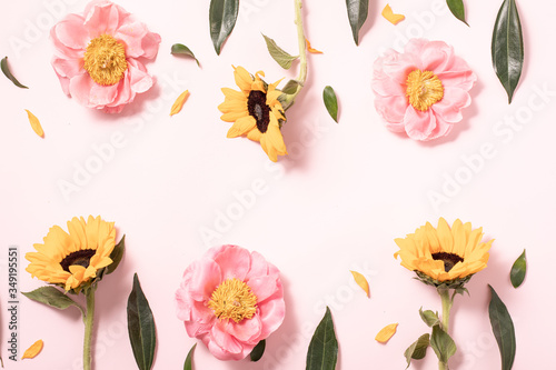 Flower layout in flat style on pastel pink backgro