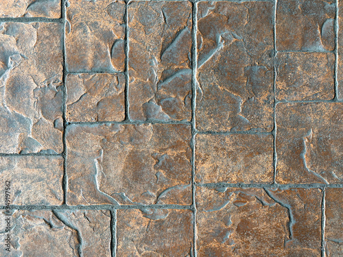 walkway is decorated with brown and dust square stone Block Bricks, giving the interior the floor of the castle with copy space. Wallpaper, background or texture.