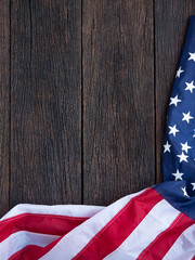 America flag waving pattern on wooden background in table top view, red blue white strip concept for USA 4th july independence day, symbol of patriot and democracy. pride in memorial day of liberty