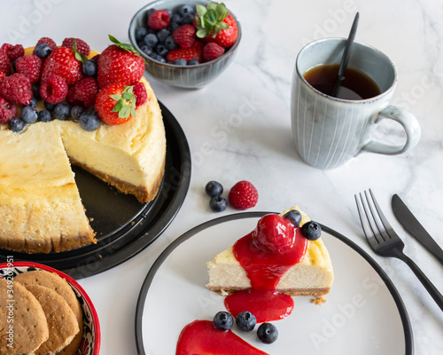Raspberry and blueberry cheesecake tea party flat lay 