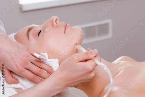Facial treatment. Beauty face care  gas-liquid procedure for woman over 30. Skin care concept.