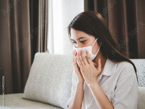 women wearing face mask stay home, in concept of Stop the spread of covid-19 or coronavirus, work from home.