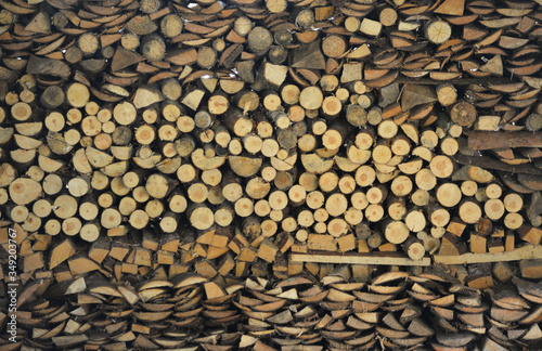 stacked wooden pieces of different shapes. firewood. wood texture
