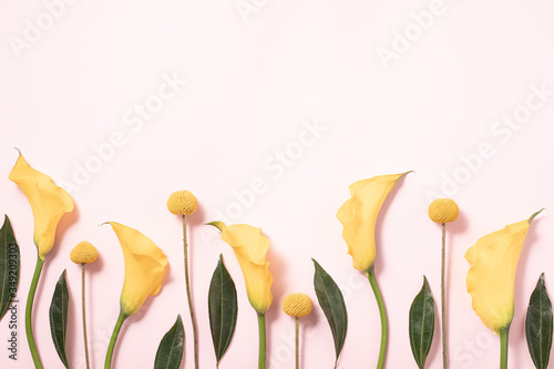 Flatlay of gift card on pink backdrop. Floral background. Spring summer conce...