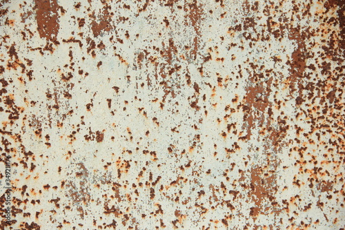 iron panel painted white with rust spots