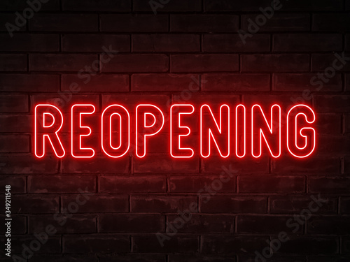 Reopening - red neon light word on brick wall background	