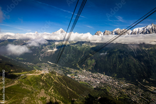 Summer view of Chamonix from the Brevent cable car, with the Mont Blanc mountain range in the background