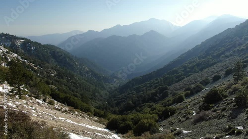 Wallpaper Mural Fly over canyons in alpine mountain spring season with snow aerial shot California Torontodigital.ca