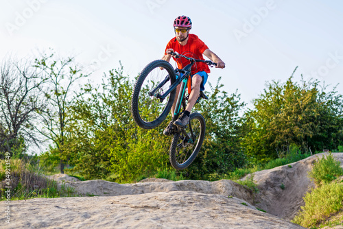 Extreme cycling concept  cyclist jumping on a mountain bike.