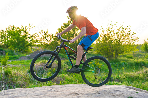 A cyclist rides a mountain bike. Extreme cycling concept.
